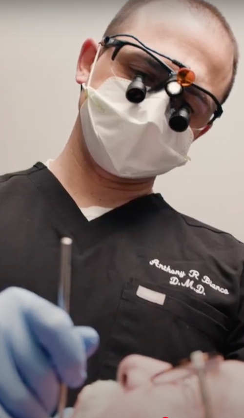Hi-Fidelity Dental man smiling in a dental chair